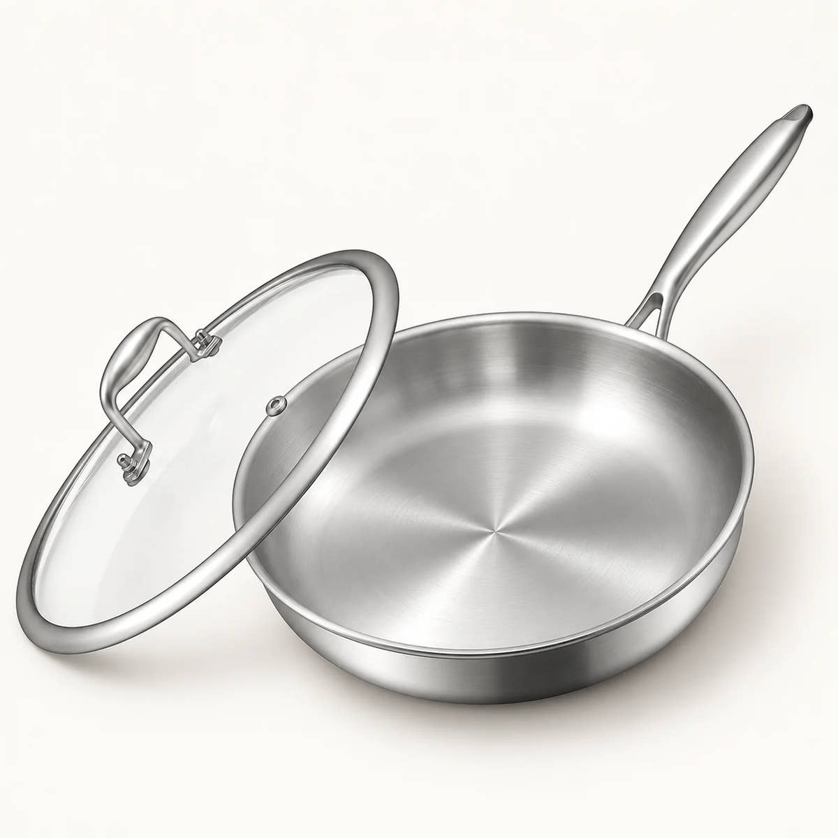 12-Inch Tri-Ply Stainless Steel Frying Pan on a warm off-white background with a soft natural shadow.