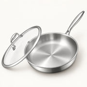 12-Inch Tri-Ply Stainless Steel Frying Pan on a warm off-white background with a soft natural shadow.