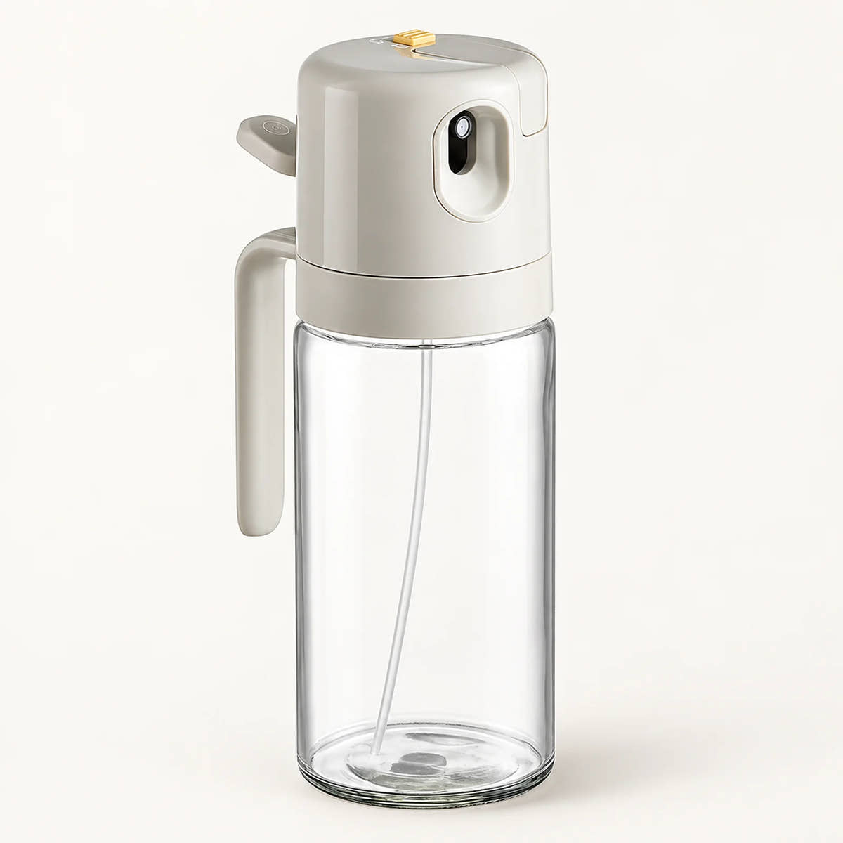 2-in-1 Glass Oil Sprayer and Dispenser on a warm off-white background with a soft natural shadow.