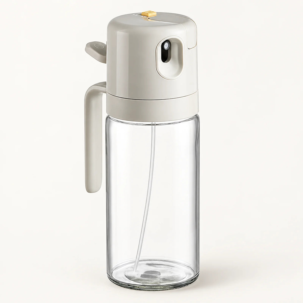 2-in-1 Glass Oil Sprayer and Dispenser on a warm off-white background with a soft natural shadow.