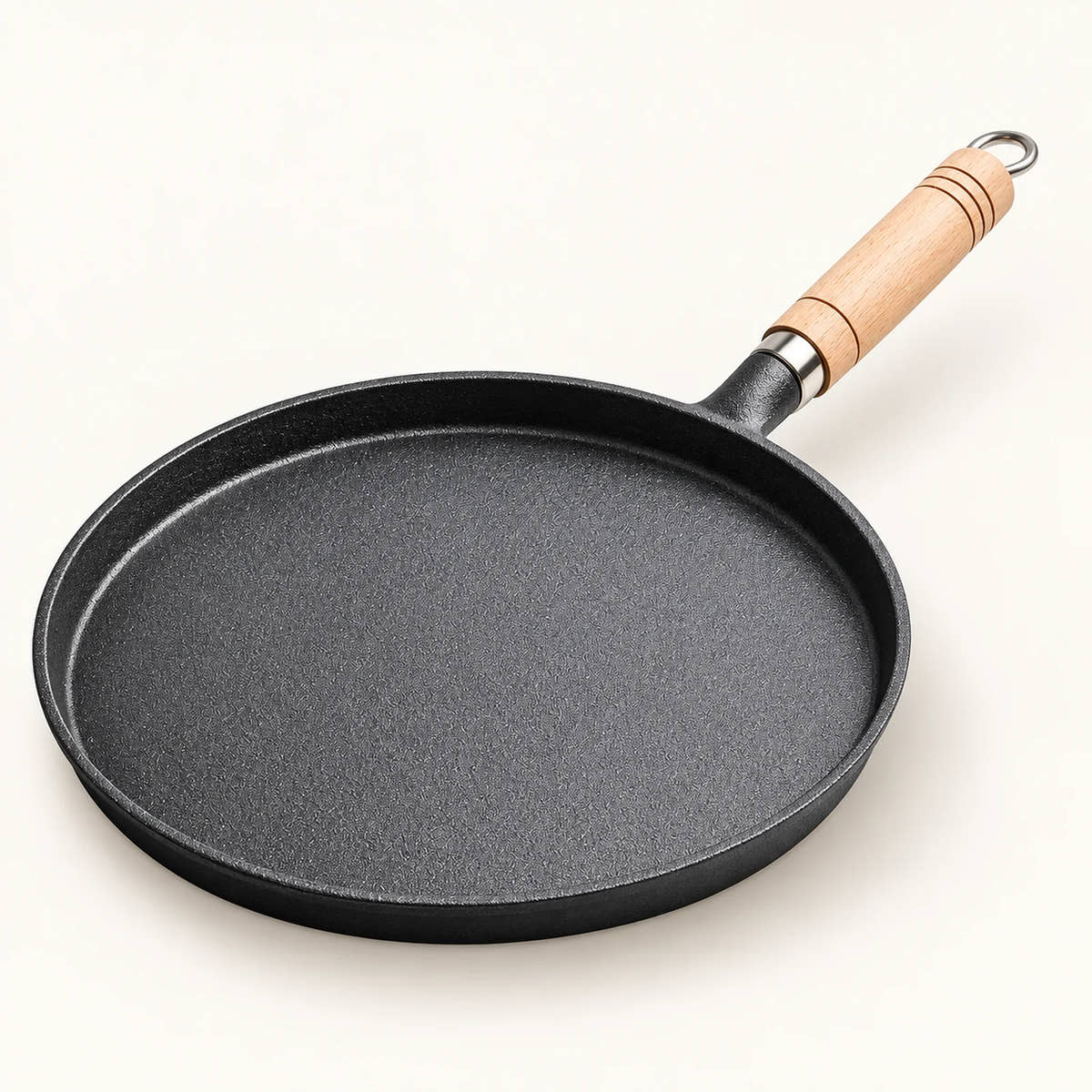 Cast Iron Frying Pan on a warm off-white background with a soft natural shadow.