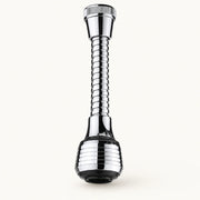 360° Dual-Mode Faucet Extender on a warm off-white background with a soft natural shadow.