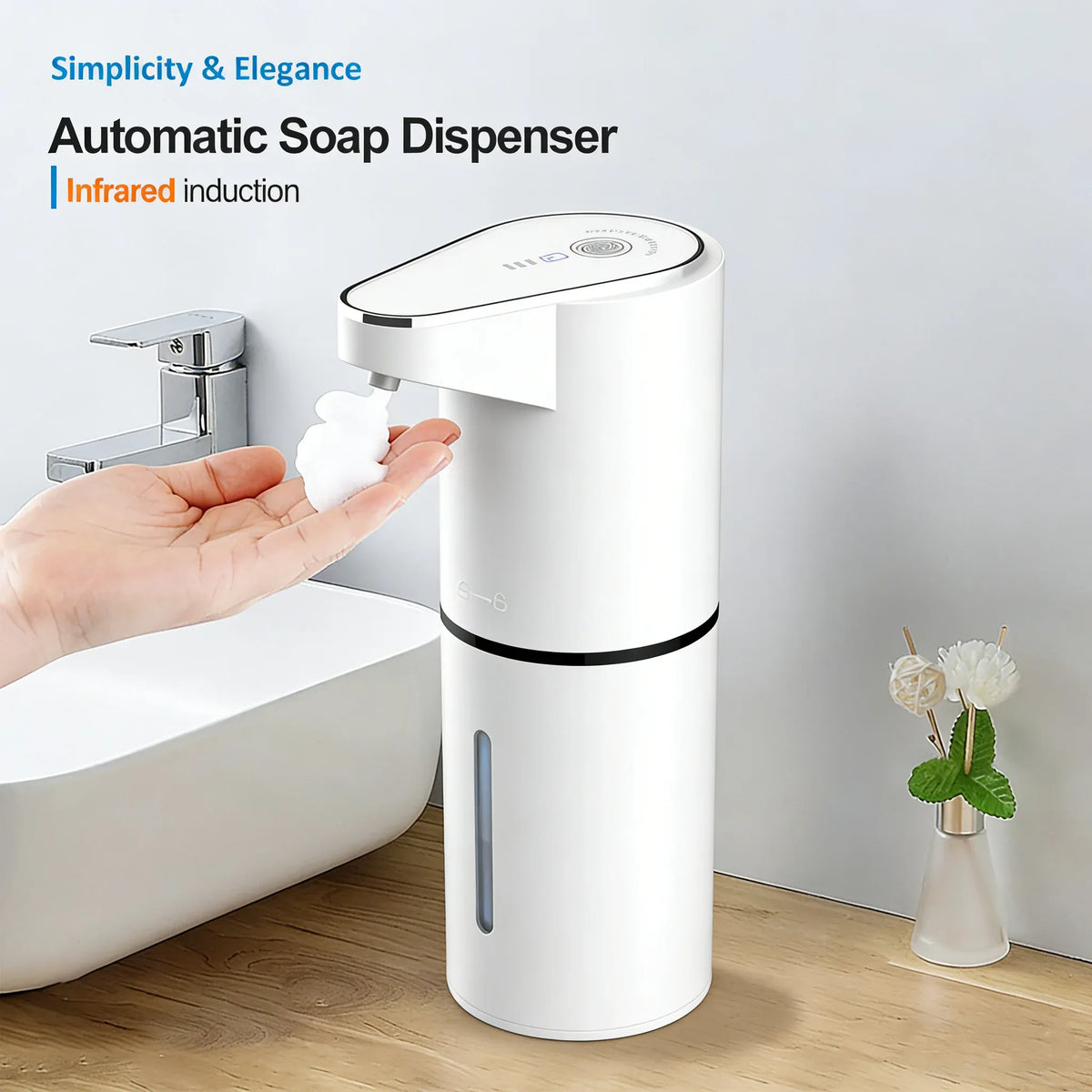 White touchless foaming soap dispenser beside a bathroom sink