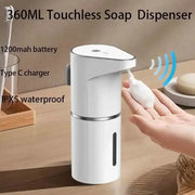 Hand activating the sensor on a white foaming soap dispenser