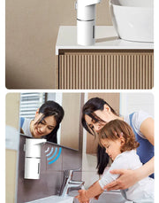 Family using a wall-mounted touchless foaming soap dispenser by a sink