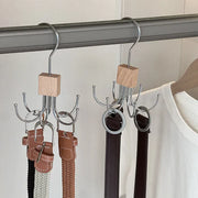 Rotating closet hooks holding belts and accessories on a rail