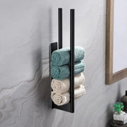 Adhesive towel bar with rolled towels stored vertically