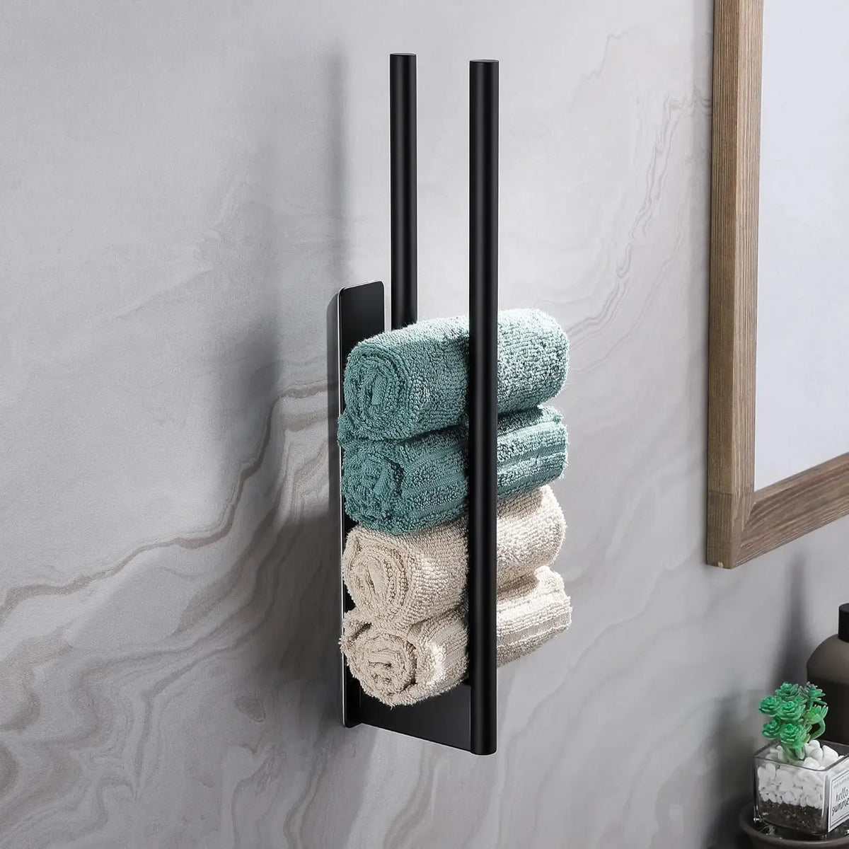 Adhesive towel bar with rolled towels stored vertically