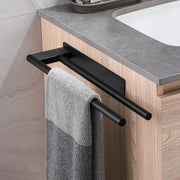 Black towel bar mounted under a bathroom counter