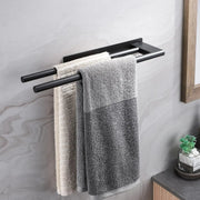 Two towels hanging from the black adhesive towel bar