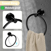 Black towel ring holding a beige hand towel