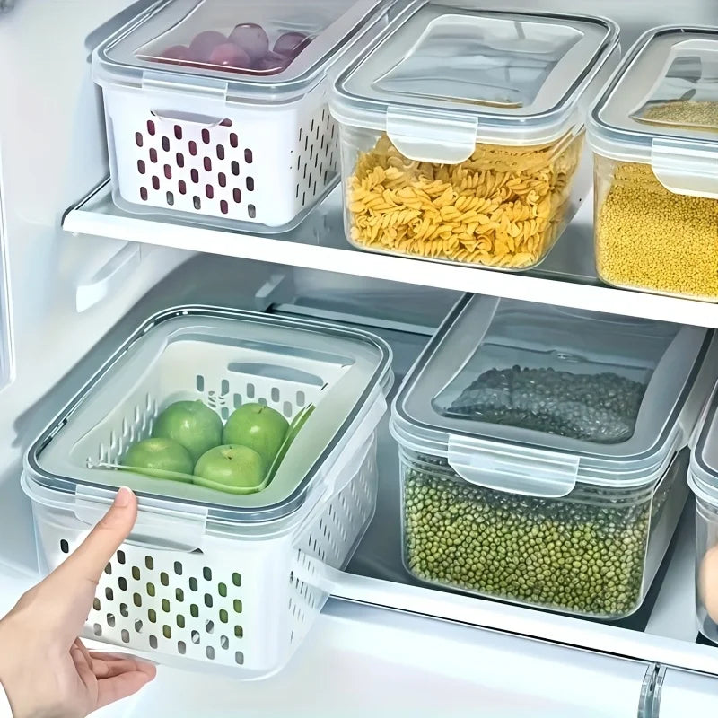 Stackable airtight food storage containers with removable drain baskets organized in a refrigerator