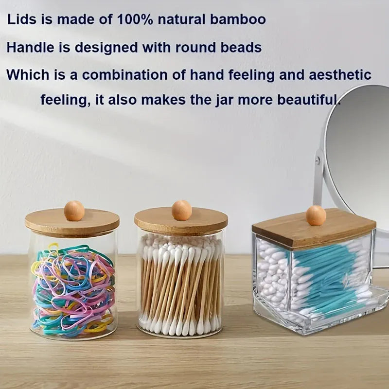 Storage jars holding cotton swabs, flossers, and elastic bands