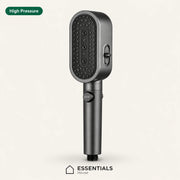 A dark gray handheld shower head with multiple spray nozzles, shown on a light beige background with 'High Pressure' text in the top-left and the 'ESSENTIALS House' logo at the bottom.