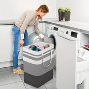 Extra-large gray laundry hamper beside a washing machine