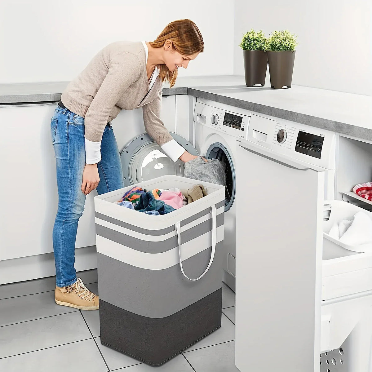 Extra-large gray laundry hamper beside a washing machine
