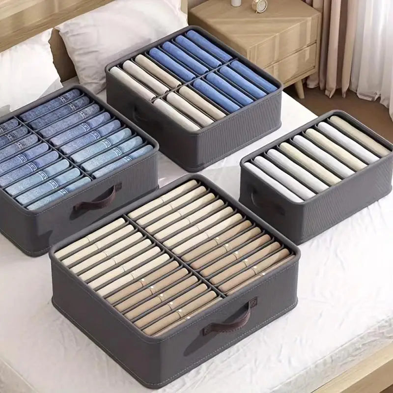 Compartment organizers holding folded clothing in drawers