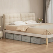 Four gray storage bins arranged beneath a bed
