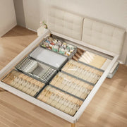 Sectioned storage bin organized beneath a lift-up bed