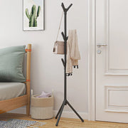 Black freestanding coat rack holding bags and clothing