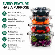 A set of four nested borosilicate glass storage containers with dark green lids, shown filled with fruit and vegetables on