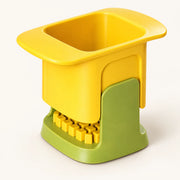 Hand-Press Vegetable Dicer on a warm off-white background with a soft natural shadow.