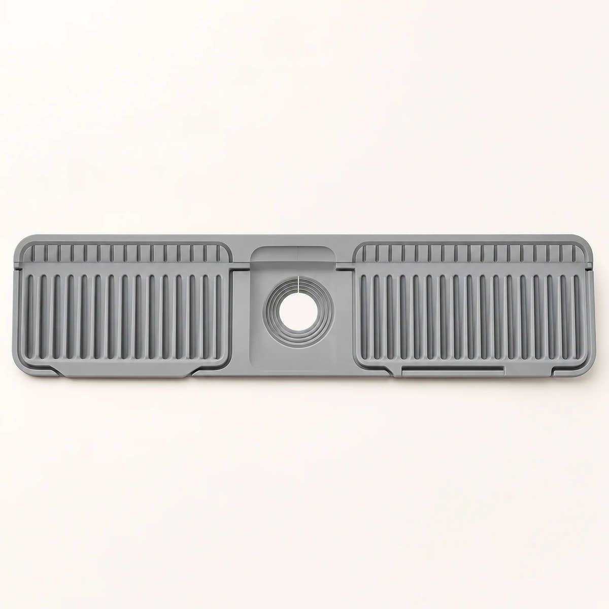 Silicone Kitchen Sink Splash Guard on a warm off-white background with a soft natural shadow.