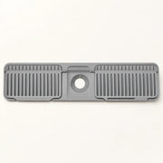 Silicone Kitchen Sink Splash Guard on a warm off-white background with a soft natural shadow.