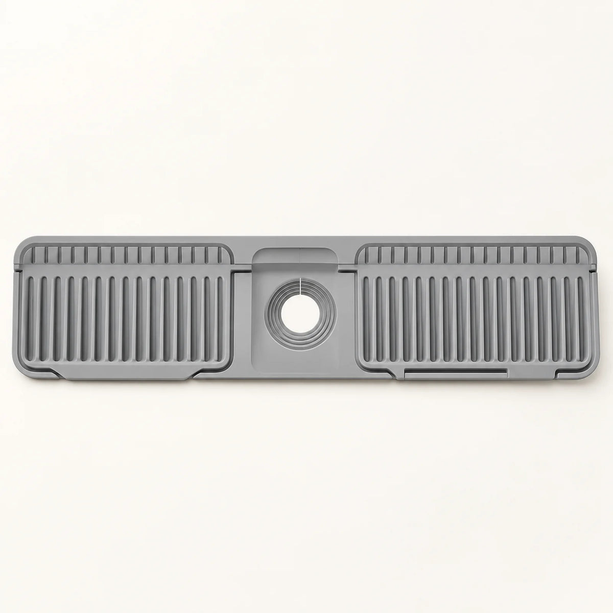 Silicone Kitchen Sink Splash Guard on a warm off-white background with a soft natural shadow.