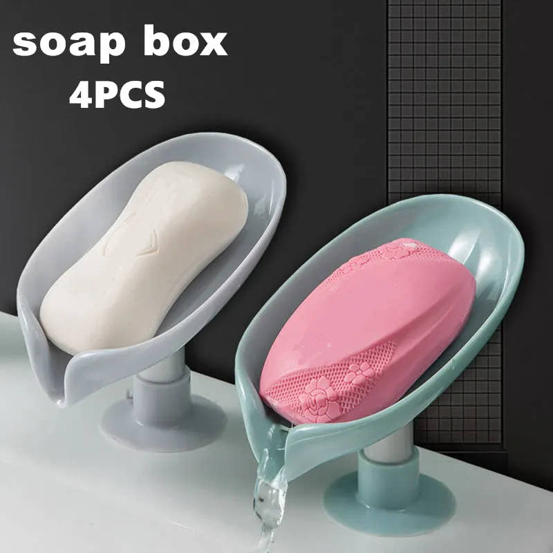 Four leaf-shaped self-draining soap dishes with bar soap