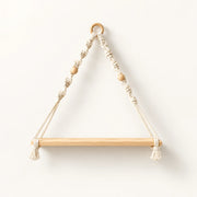 Wooden hanging shelf with braided macrame ropes