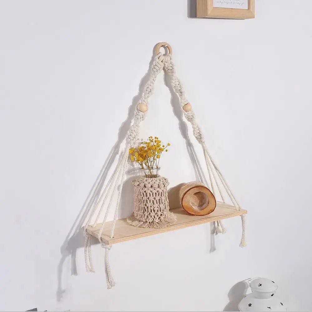 Macrame wall hanging shelf in a triangle frame design with wooden shelf