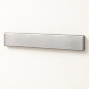 Wall-Mounted Magnetic Knife Holder on a warm off-white background with a soft natural shadow.