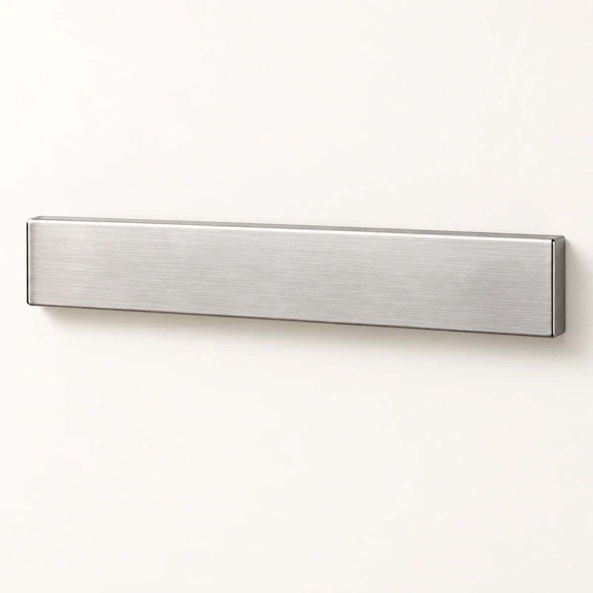 Wall-Mounted Magnetic Knife Holder on a warm off-white background with a soft natural shadow.
