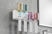 Toothbrush organizer with cups and toothbrushes mounted on tile