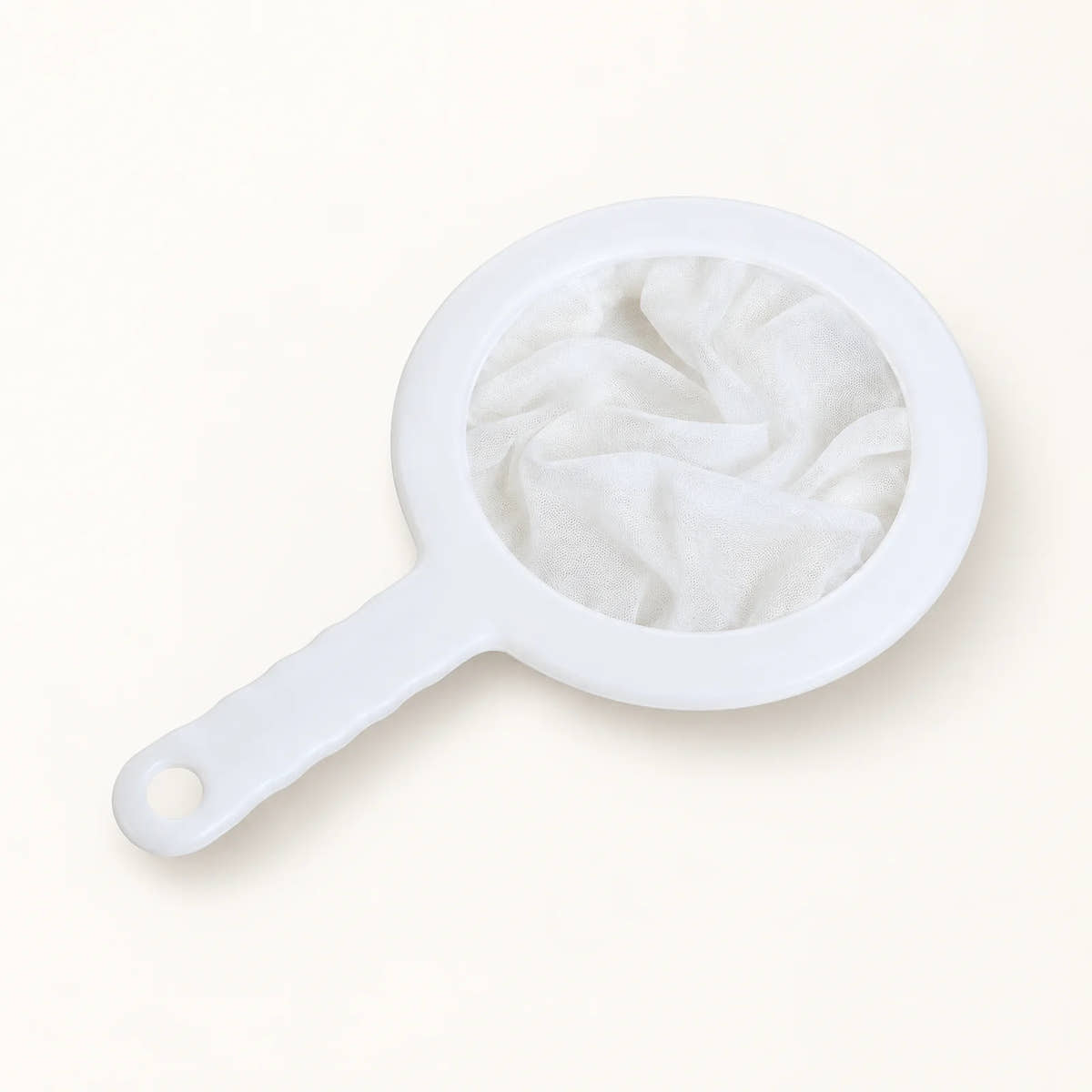 Reusable Fine-Mesh Filter Bags on a warm off-white background with a soft natural shadow.