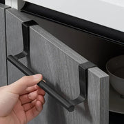 Gray over-cabinet towel bar attached to a cabinet door