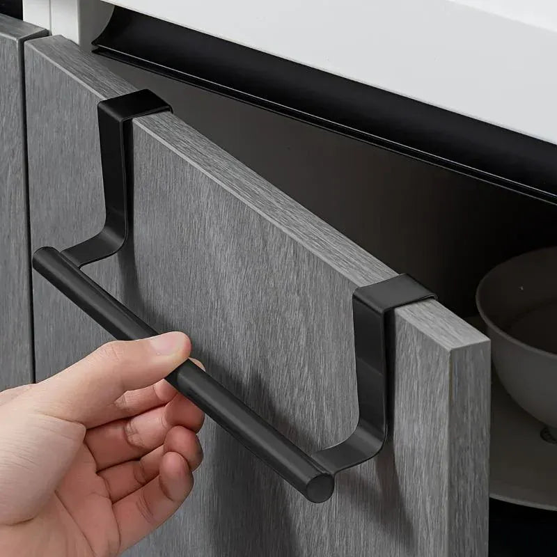 Gray over-cabinet towel bar attached to a cabinet door