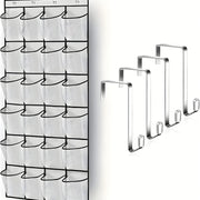 Black shoe organizer hanging on a white door