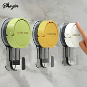 Four colorful suction hooks mounted on tile