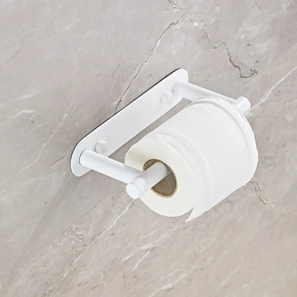 White rotating toilet paper holder mounted on marble tile