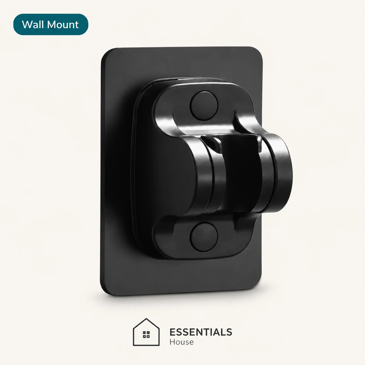A black wall mount clip with a rectangular backplate, shown on a light off-white background. A dark teal label at the top left reads 'Wall Mount', and the 'ESSENTIALS House' logo appears at the bottom.