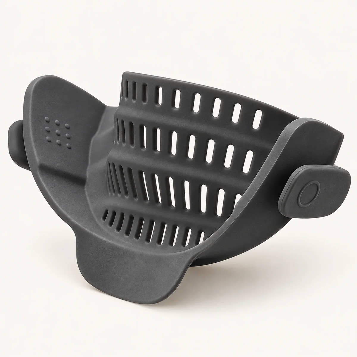 Silicone Clip-On Pot Strainer on a warm off-white background with a soft natural shadow.