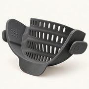 Silicone Clip-On Pot Strainer on a warm off-white background with a soft natural shadow.