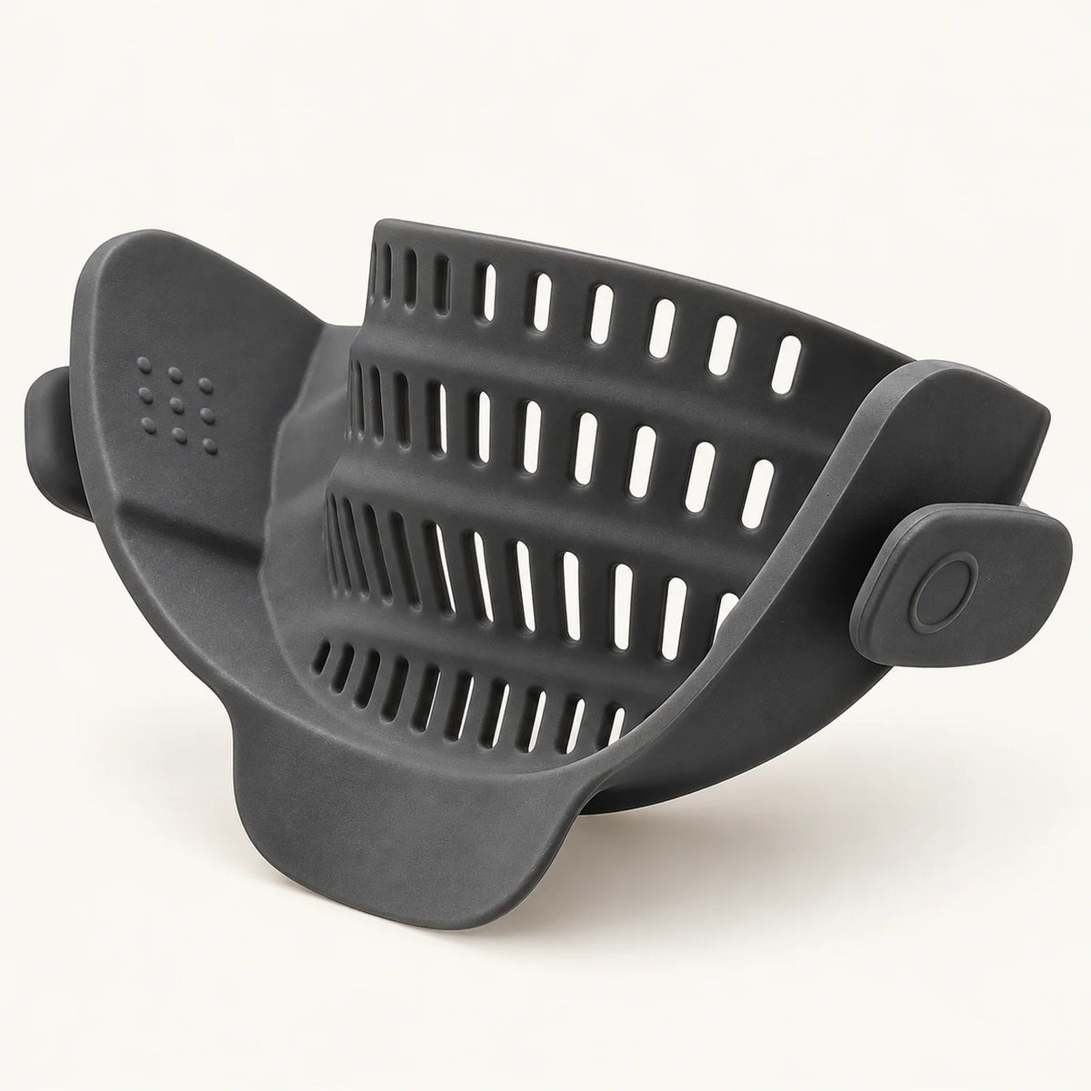 Silicone Clip-On Pot Strainer on a warm off-white background with a soft natural shadow.