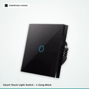 A 1-gang black smart touch light switch with a glossy glass faceplate and a single circular touch point