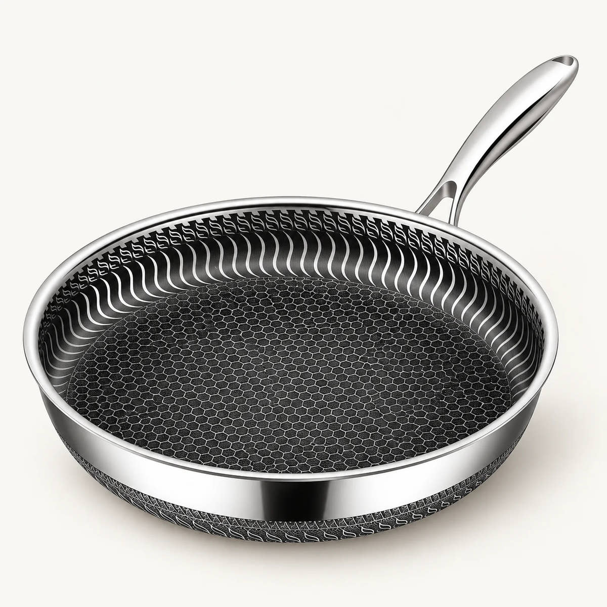 Stainless Steel Honeycomb Frying Pan on a warm off-white background with a soft natural shadow.