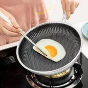Stainless steel honeycomb frying pan with a laser-engraved nonstick pattern