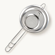 3-Piece Fine Mesh Strainer Set on a warm off-white background with a soft natural shadow.