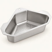 Stainless Steel Corner Sink Basket on a warm off-white background with a soft natural shadow.